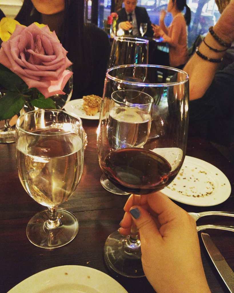 Tasting wine at an elegant restaurant in New York City.